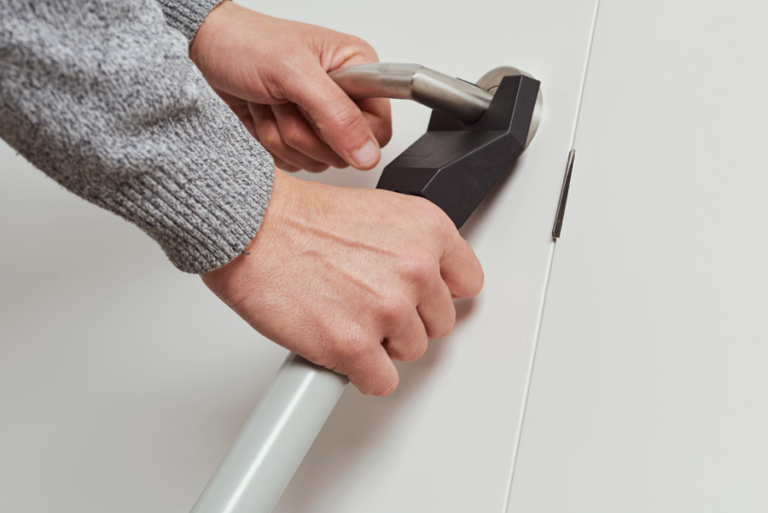 Installing a security bar under a door knob